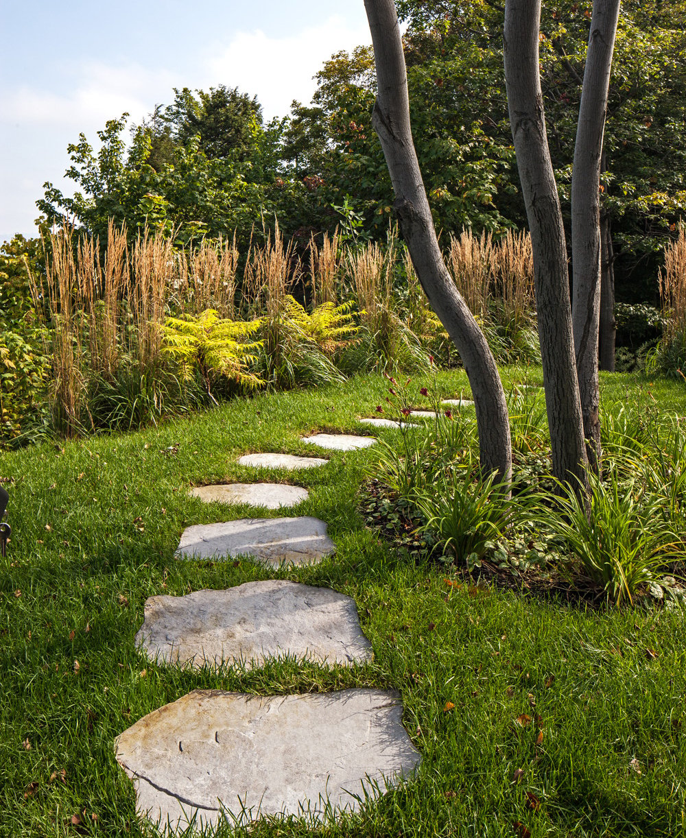 Maya concrete stone walkway through the backyard. 