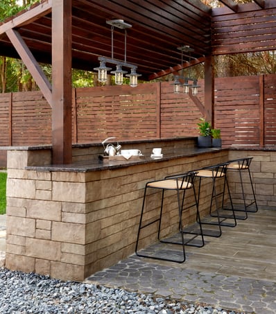 Outdoor bar area designed with Techo-Bloc products