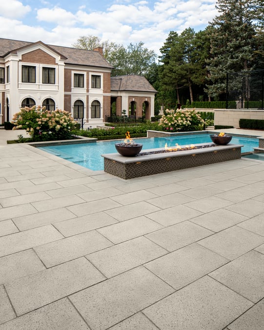Backyard swimming pool design featuring Techo-Bloc's Para patio slab