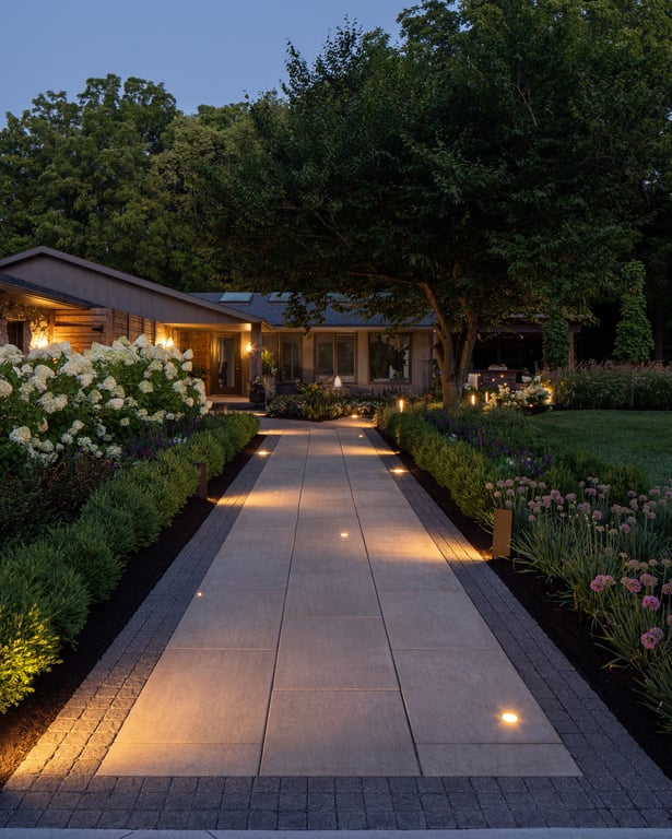 Backyard walkway design with lighting and Techo-Bloc pavers and patio slabs