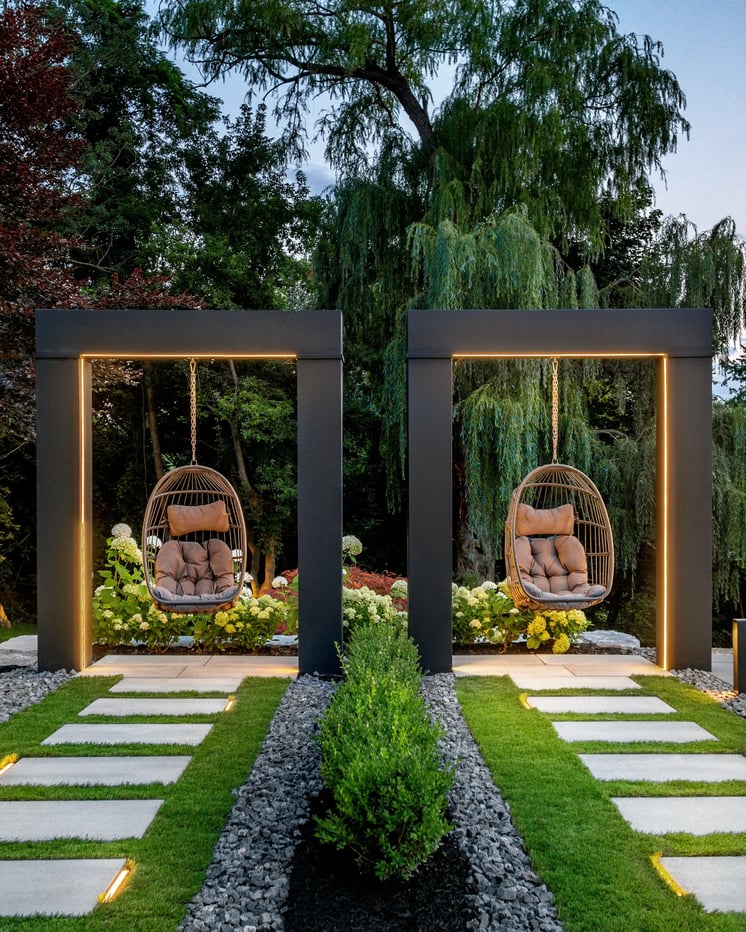 Backyard with two swings featuring Blu Grande patio slabs