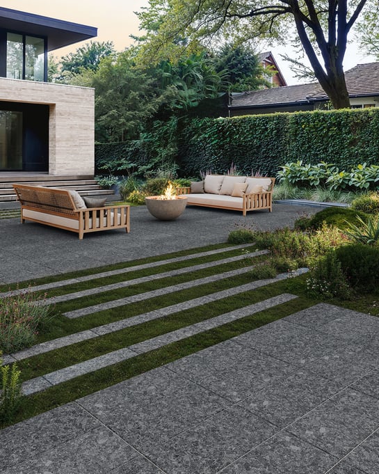 Modern backyard patio design with fire bowl