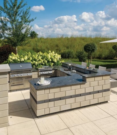 Timeless Outdoor Kitchen with stone countertops by Techo-Bloc