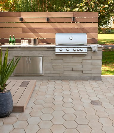 Modern, eclectic outdoor kitchen designed with Techo-Bloc products.