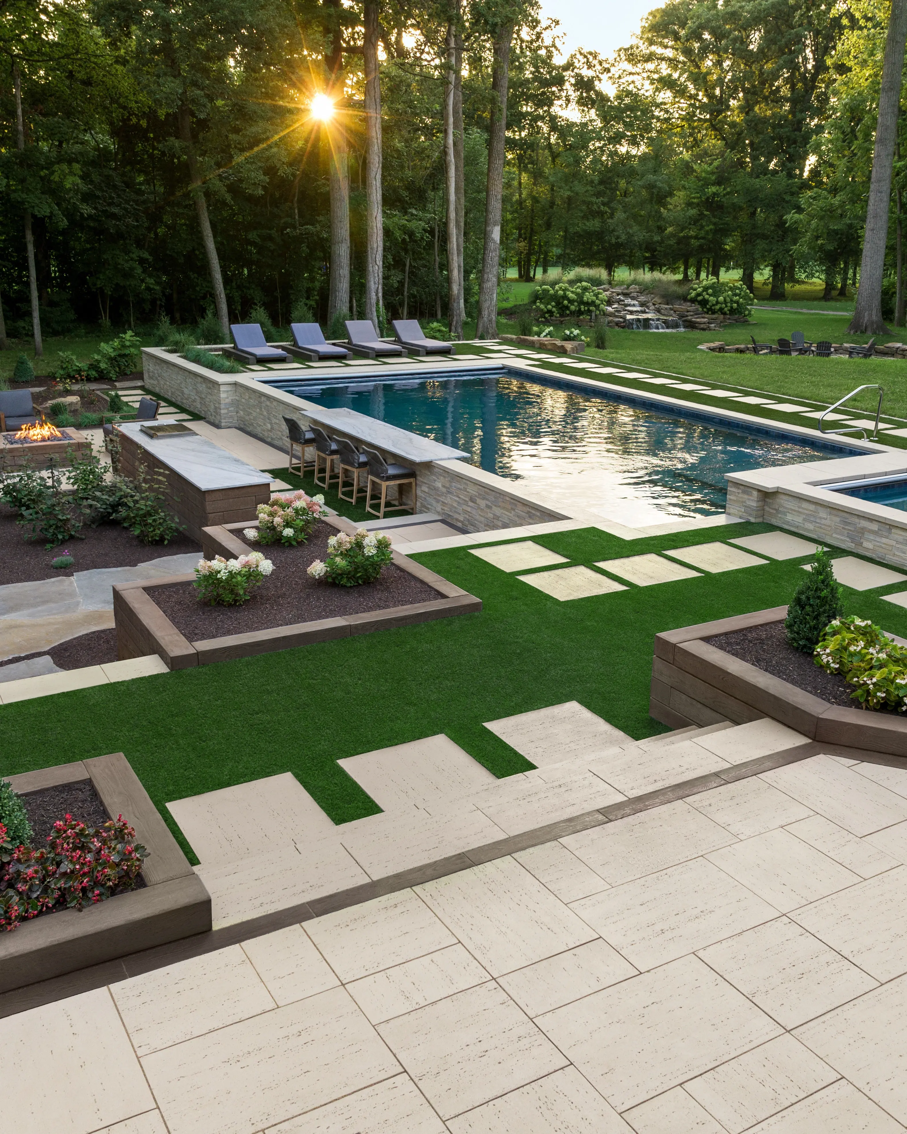 Swimming pool design featuring Techo-Bloc pavers and patio slabs