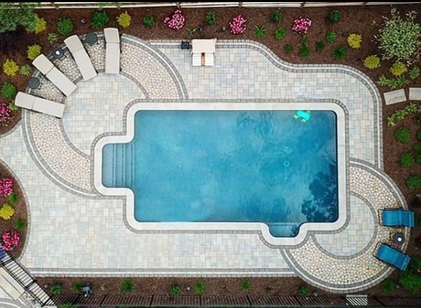 Traditional poolside backyard patio featuring three of our pavers. 